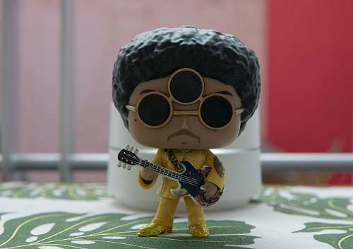 leisure activities person playing guitar figurine musical instrument